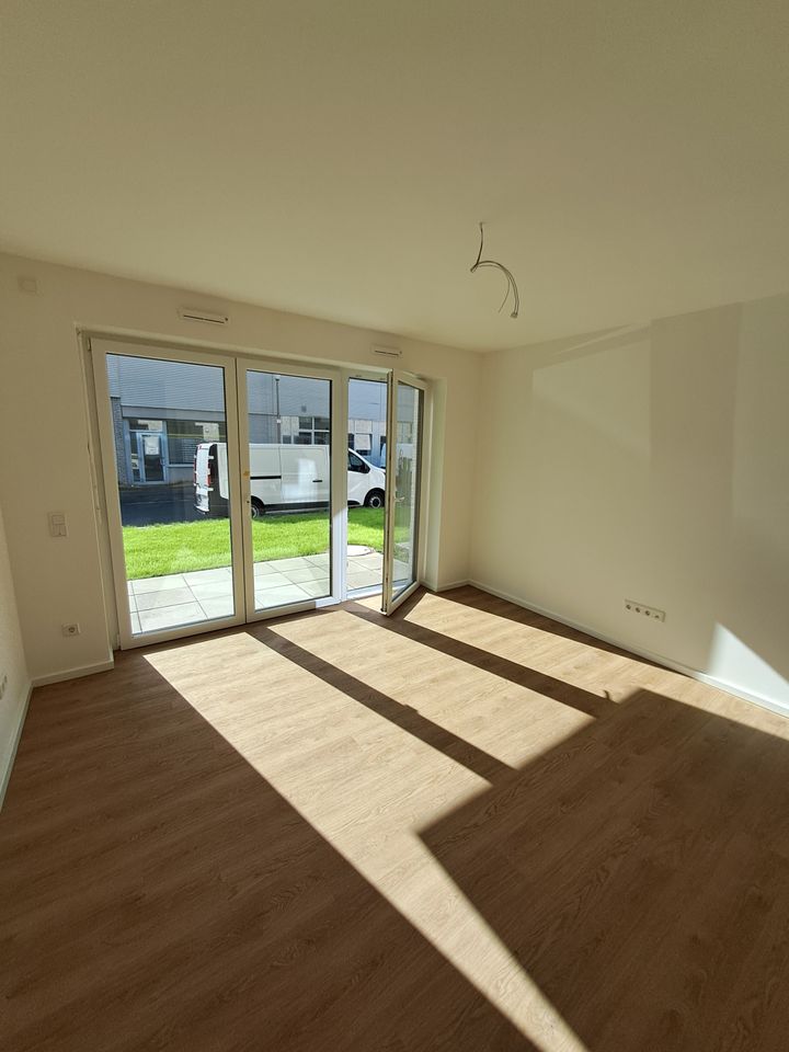 Wohnzimmer mit offener Küche